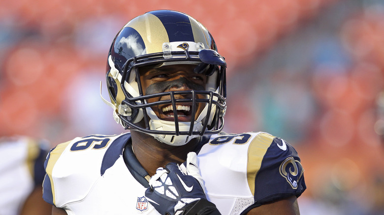 Michael Sam smiling on football field in uniform