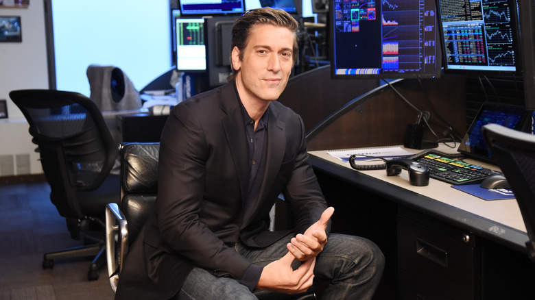 David Muir sitting in a news room