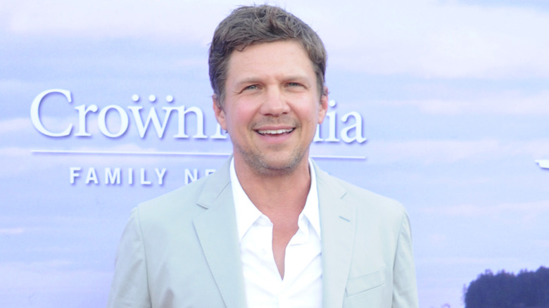 Marc Blucas wearing a gray suit