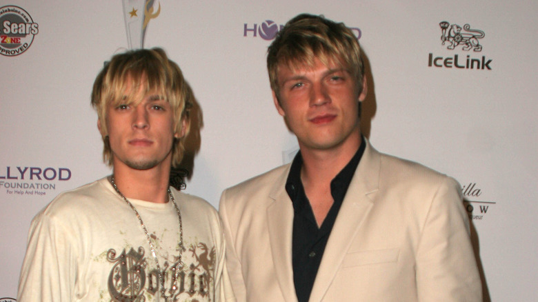 Nick and Aaron Carter on the red carpet, smiling