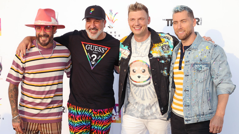 AJ McLean and Nick Carter posing with Joey Fatone and Lance Bass