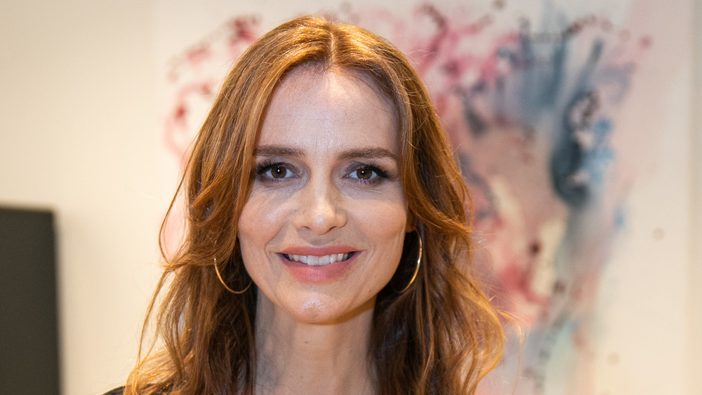 Saffron Burrows poses