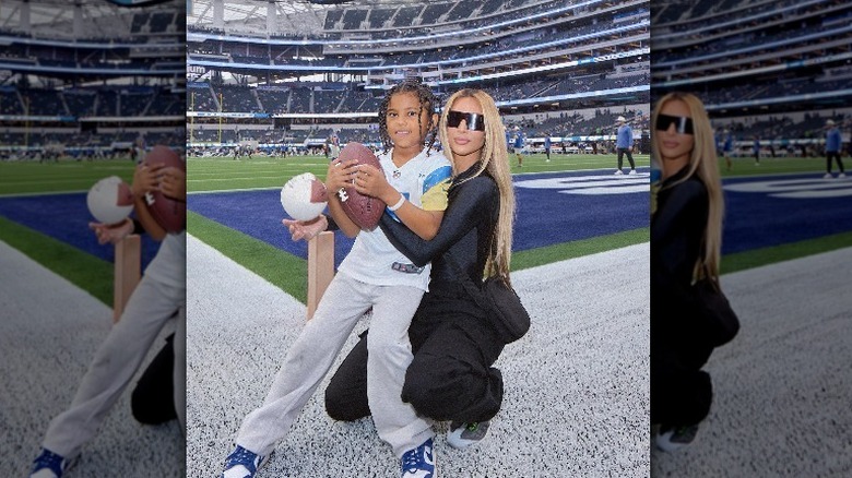 Saint West and Kim Kardashian at a game