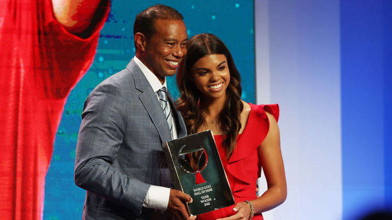 Sam Alexis Woods and Tiger Woods smiling