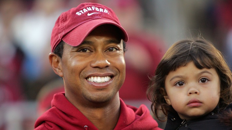 Sam Alexis Woods and Tiger Woods smiling