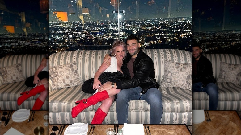 Sam Asghari and Britney Spears on the couch