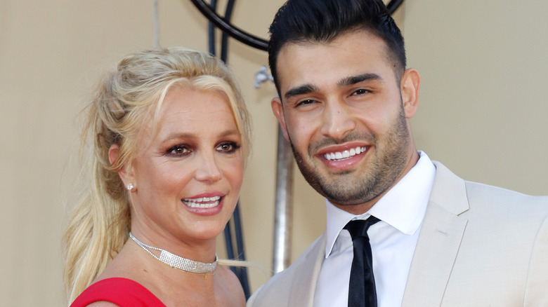 Sam Asghari and Britney Spears pose 