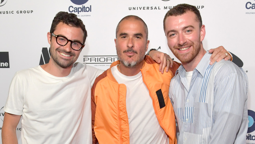 Jimmy Napes, Zane Lowe, and Sam Smith pose for cameras