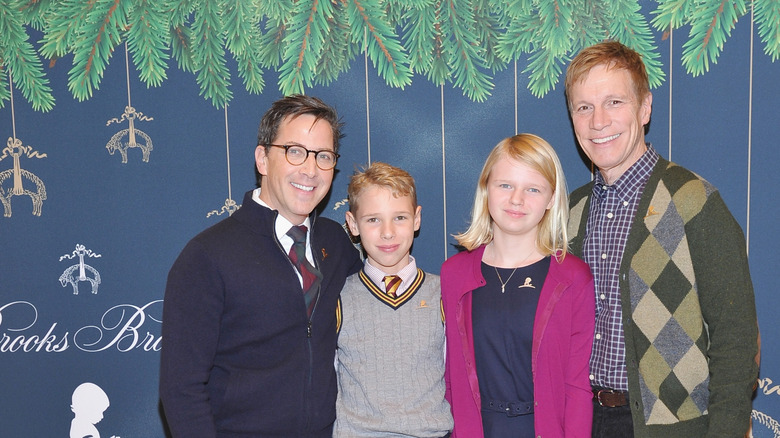 Dan Bucatinsky posing with his husband and kids