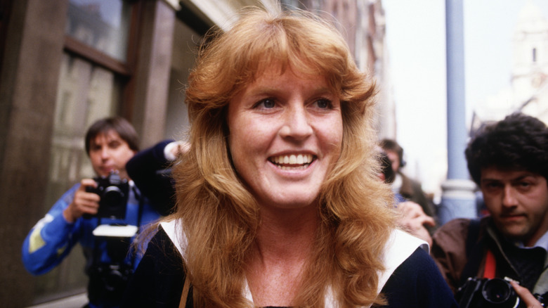 Sarah Ferguson surrounded by press