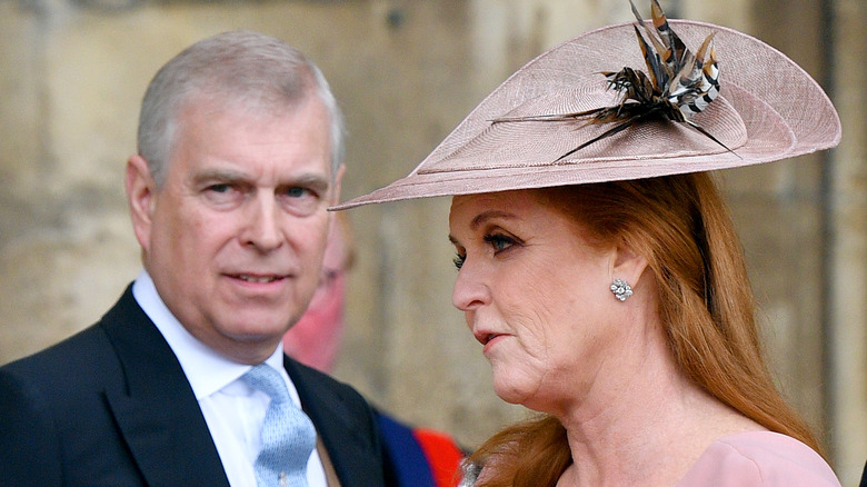 Sarah Ferguson talking, Prince Andrew behind