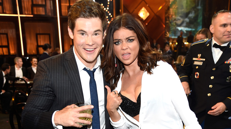 Sarah Hyland and Adam Devine smiling