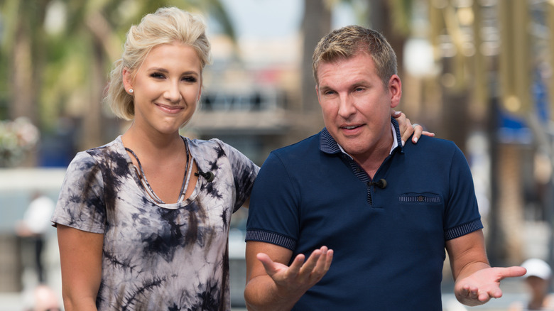 Savannah Chrisley smiling Todd Chrisley shrugging