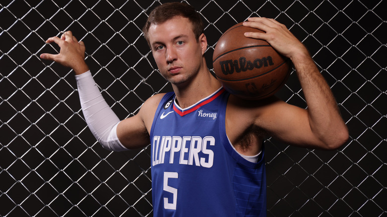 Luke Kennard posing with a basketball