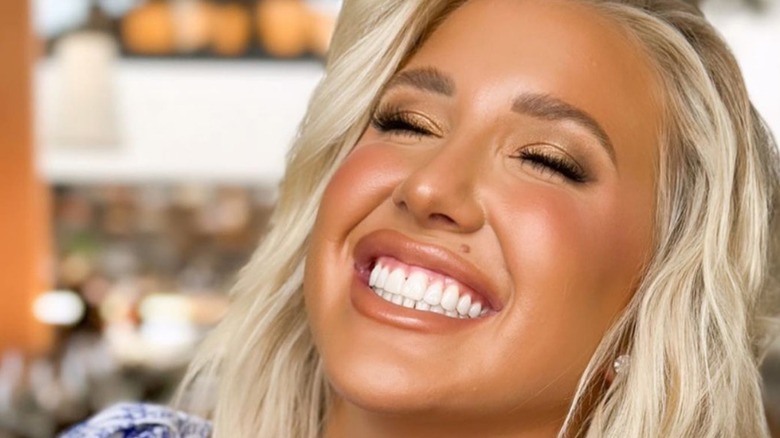 Savannah Chrisley head back laughing