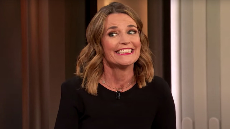 Savannah Guthrie cheekily smiling and slightly shrugging shoulders