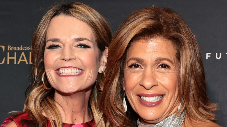 Savannah Guthrie and Hoda Kotb posing for cameras 