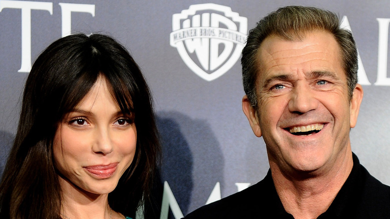 Mel Gibson and Oksana Grigorieva smiling together