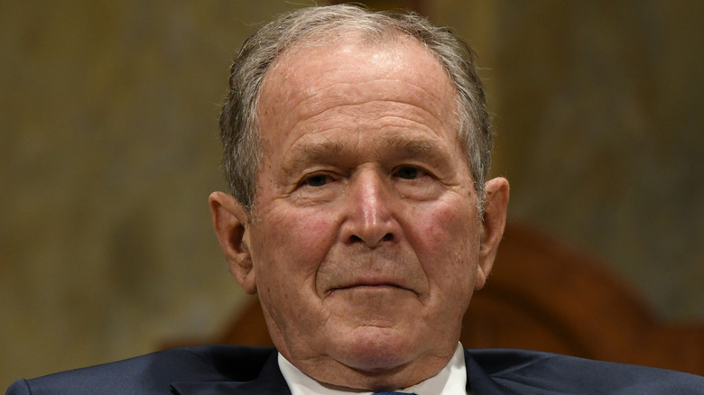 George W. Bush posing for cameras