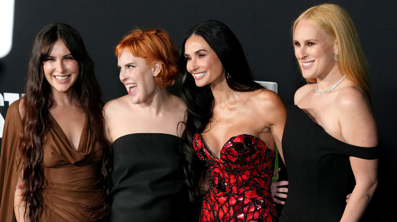 Demi Moore posing with her daughters