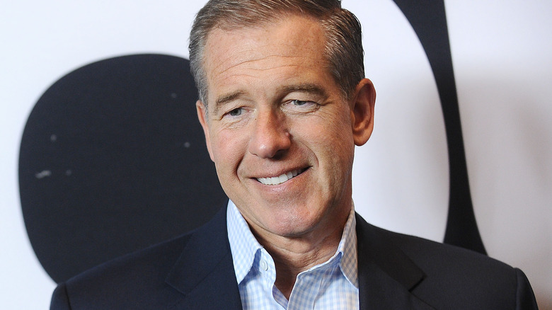 Brian Williams smiling meekly 