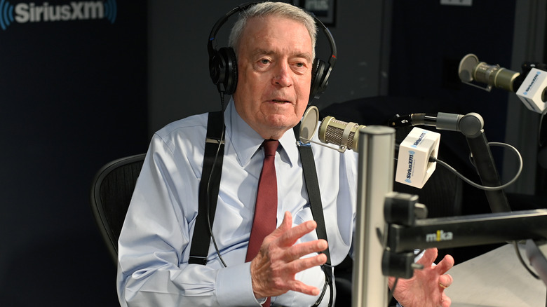 Dan Rather sat at mic