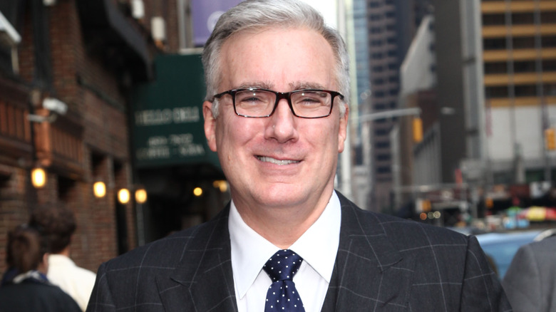 Keith Olbermann grinning on street