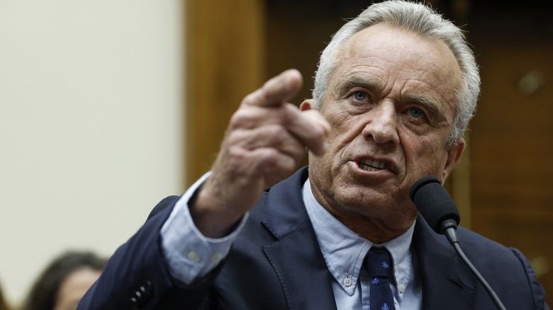 Robert F. Kennedy Jr. gesticulates, talks into mic