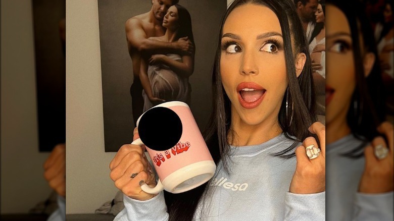 Scheana Shay holding mug and showing ring