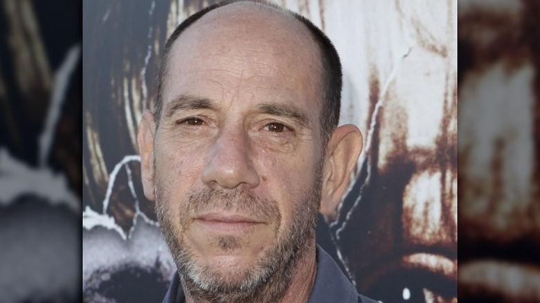 Miguel Ferrer looking at camera