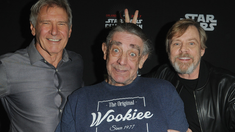 Peter Mayhew joking with Harrison Ford and Mark Hamill