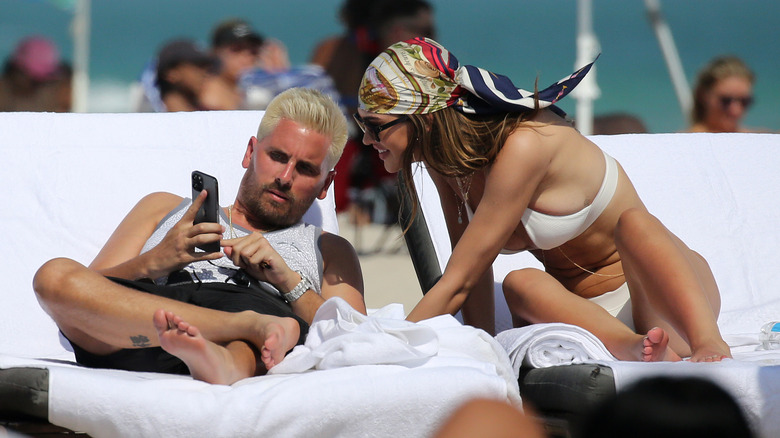 Scott Disick and Amelia Hamlin at the beach