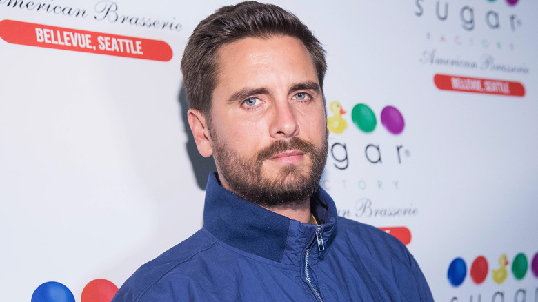 Scott Disick poses in blue jacket