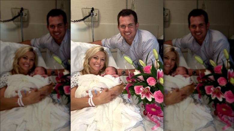 Ainsley Earhardt and Will Proctor pose with their newborn daughter