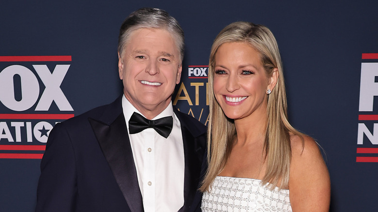 Sean Hannity and Ainsley Earhardt smiling together red carpet