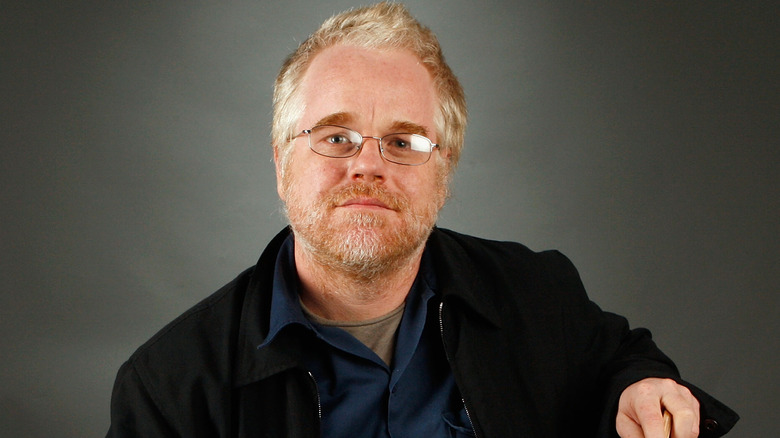 Philip Seymour Hoffman posing with a cane