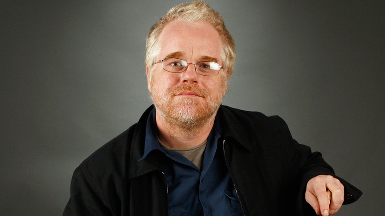 Philip Seymour Hoffman posing with a cane