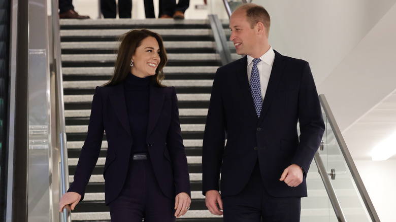 Kate Middleton and Prince William, both wearing black outfits