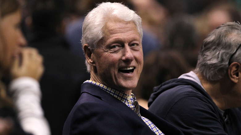 Bill Clinton smiling in crowd