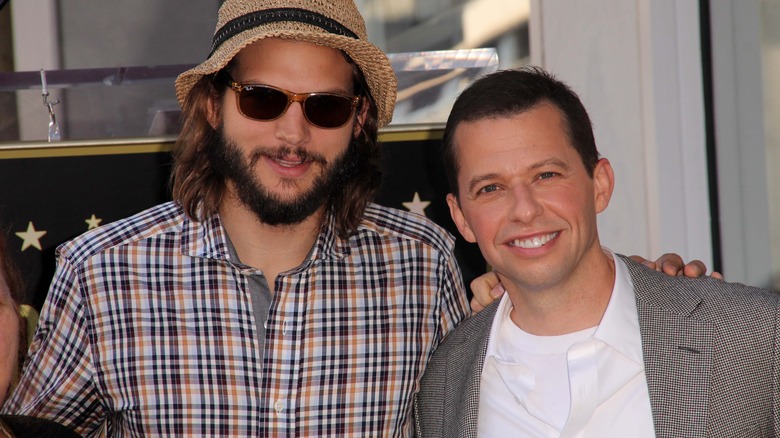 Ashton Kutcher and Jon Cryer pose together 