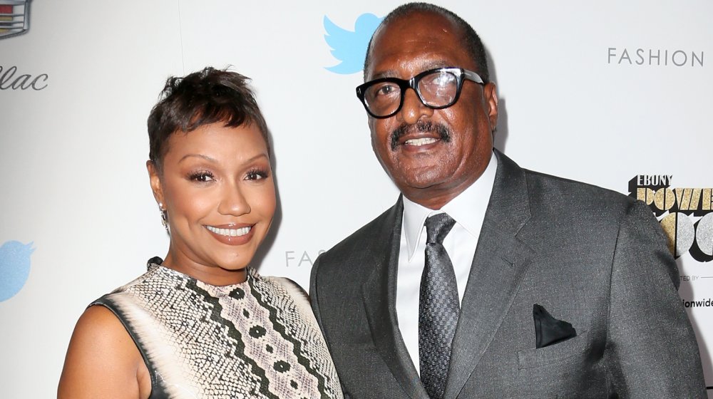 Gena Charmaine Avery and Mathew Knowles posing together, both smiling