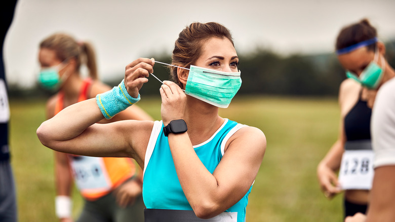 runner putting on mask