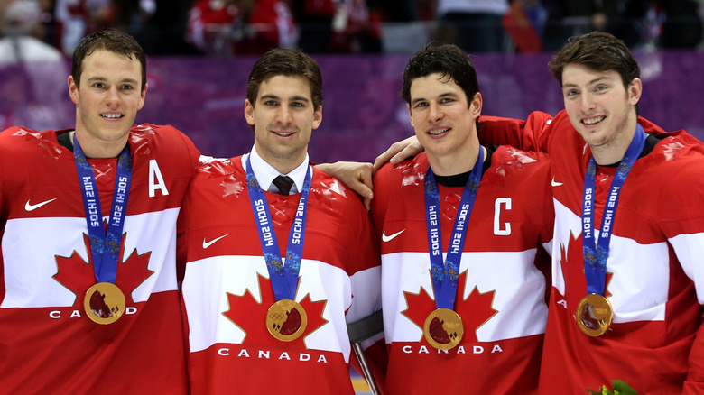 Jonathan Toews, John Tavares, Sidney Crosby, and Matt Duchene wearing gold medals