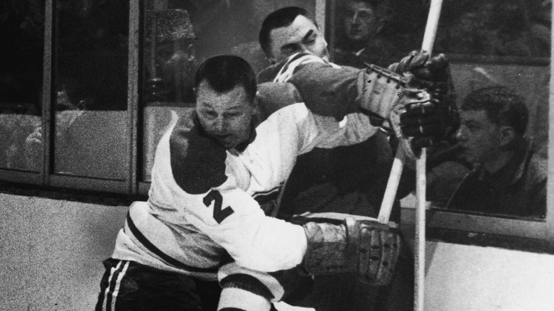 Doug Harvey slamming an opponent against the boards