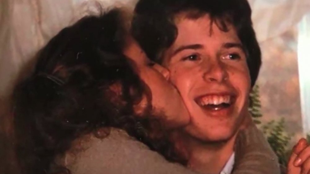 Michelle Duggar kissing Jim Bob Duggar in a throwback photo
