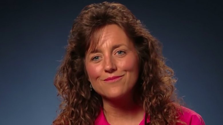 Michelle Duggar sitting for a confessional on her family's reality TV show 