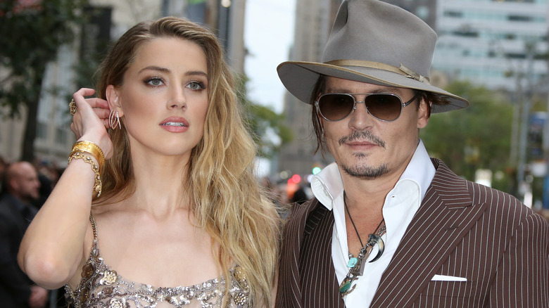 Amber Heard with Johnny Depp on the street