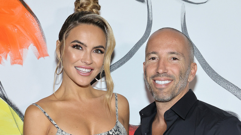 Chrishell Stause poses with Jason Oppenheim