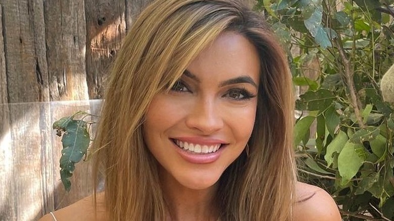 Chrishell Stause smiling at a koala zoo