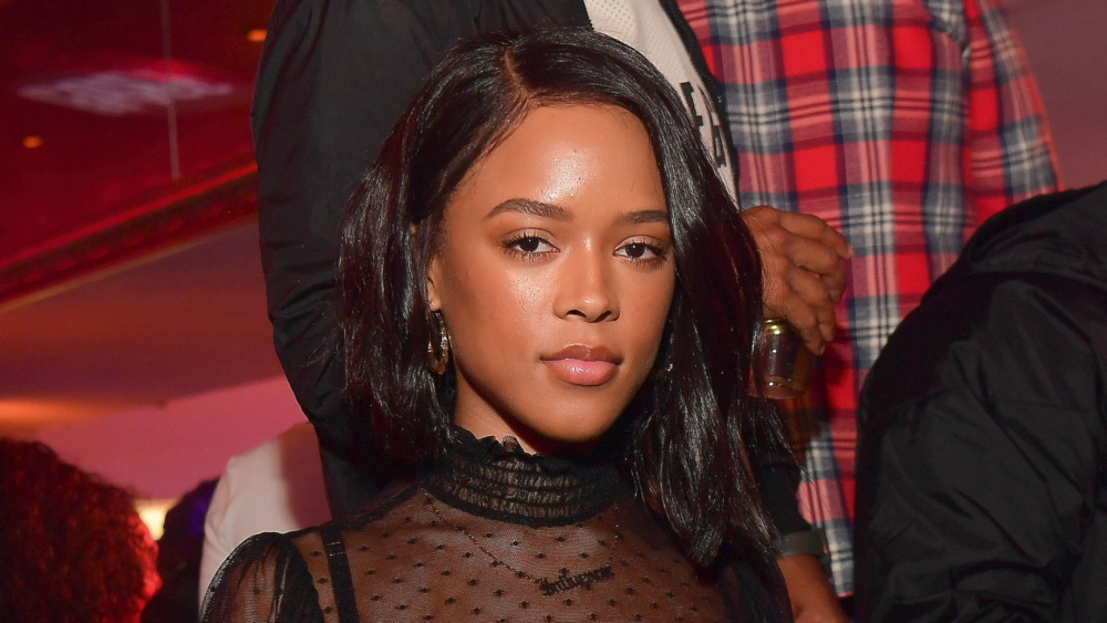 Serayah McNeill looking stoically into the camera 